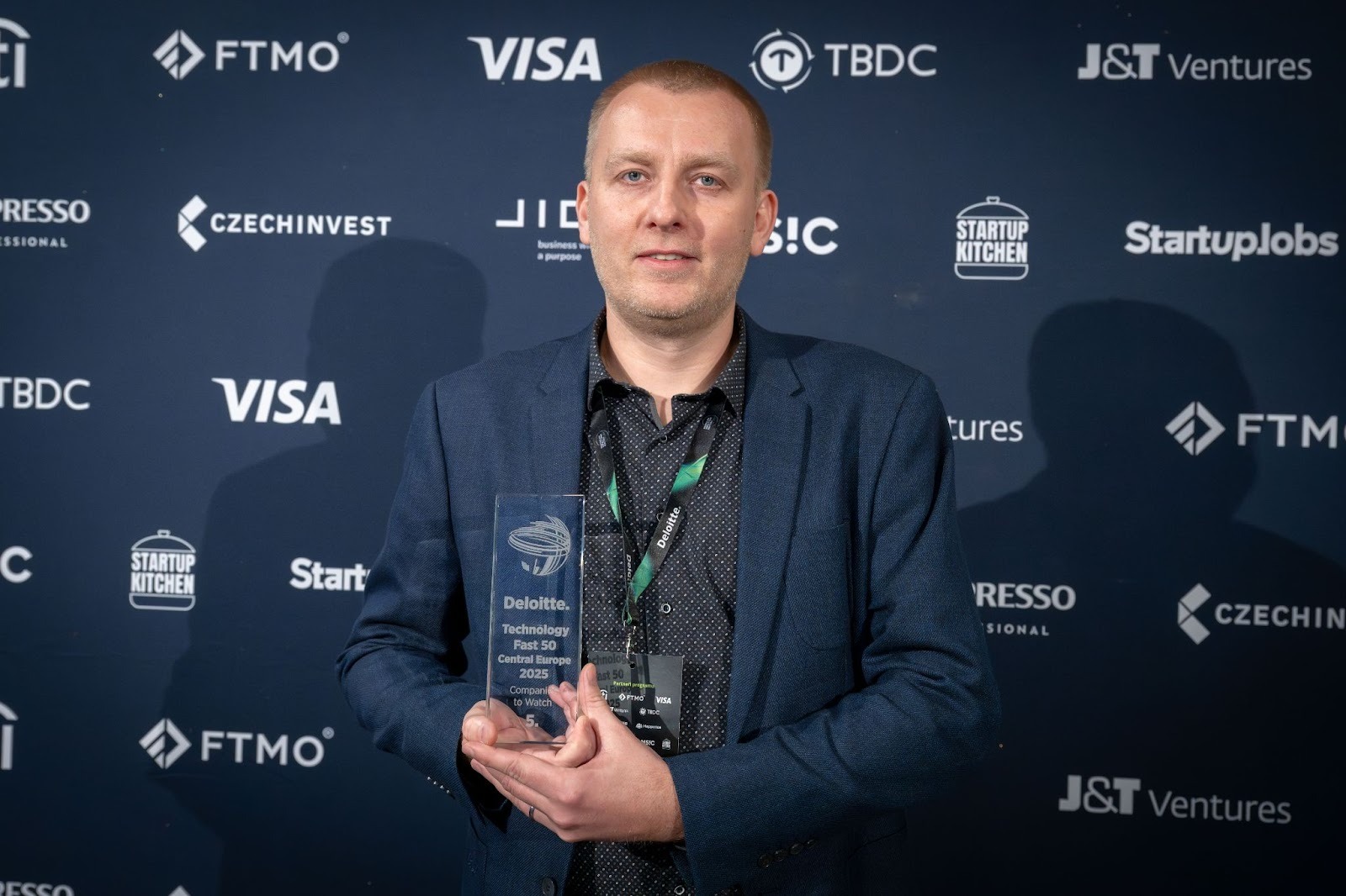 Pavol Korcek at Deloitte Technology Fast 50 with trophy